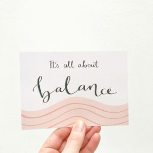 Printed postcard with hand lettered text 'It's all about balance'