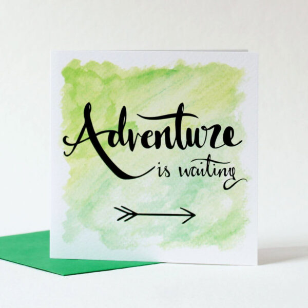 Green card with hand lettered text 'Adventure is waiting' and illustrated arrow