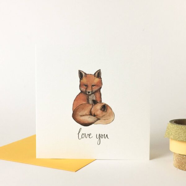 Printed card - illustration of two cute foxes cuddling, with 'love you' text beneath