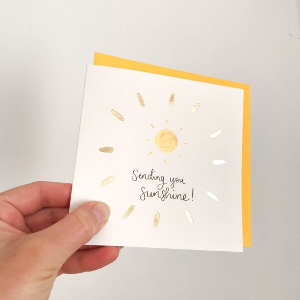Greeting card - reads 'Sending you sunshine' with sunshine design and gold foil detail