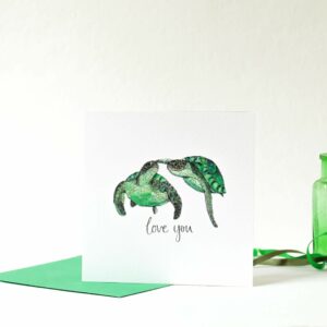 Printed card - two turtles swimming touching flipper to nose and 'love you' text printed beneath