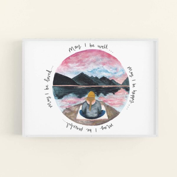 Calming meditating girl sat beneath mountains illustration, words surround the illustration 'May I be well... may I be happy... may I be peaceful... may I be loved' - in a white frame