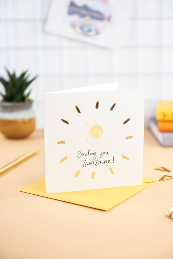 Pretty desk featuring Sending you sunshine card with sunshine design and gold foil detail