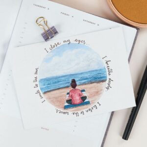 Illustrated postcard with meditation design and words reading 'I close my eyes, I breathe deeply, I listen to the waves, I smile to the sun.'