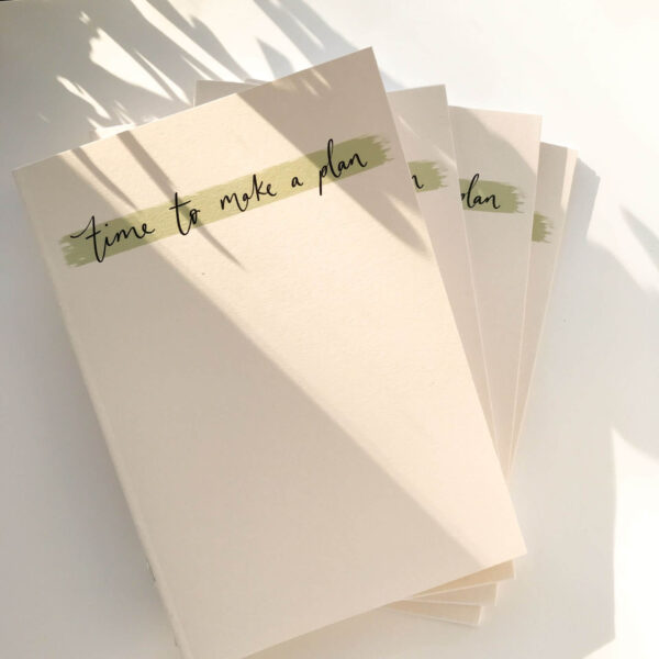 Stack of 'time to make a plan' notebooks in minimal design