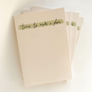 Stack of 'time to make a plan' notebooks in minimal design