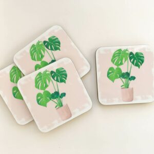 Stack of house plant coasters with monstera illustration design