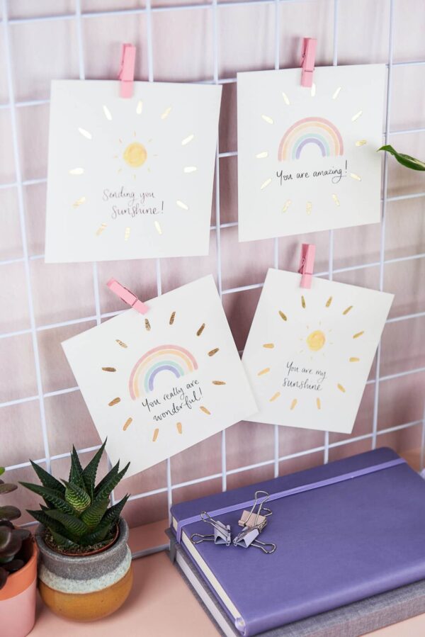 Positive greetings card designs with sunshines, rainbows, positive quotes and gold foil detailing
