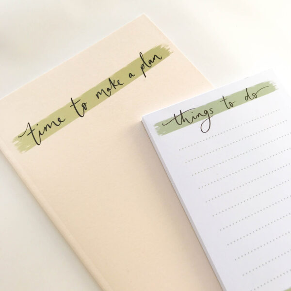 'Things to do' notepad, on top of a 'time to make a plan' notebook