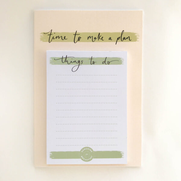 'Things to do' notepad, on top of a 'time to make a plan' notebook