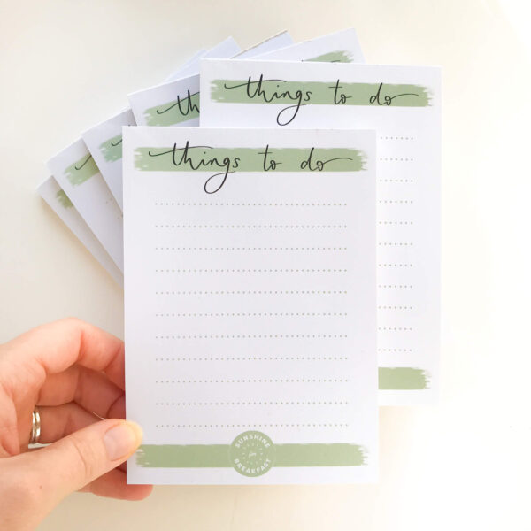 Stack of notepads in minimal green and white design, with 'Things to do' title at top of page