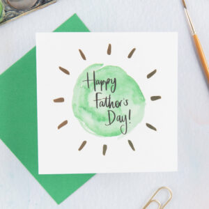 Card reads 'Happy Father's Day!' with green circular design and gold foil detail