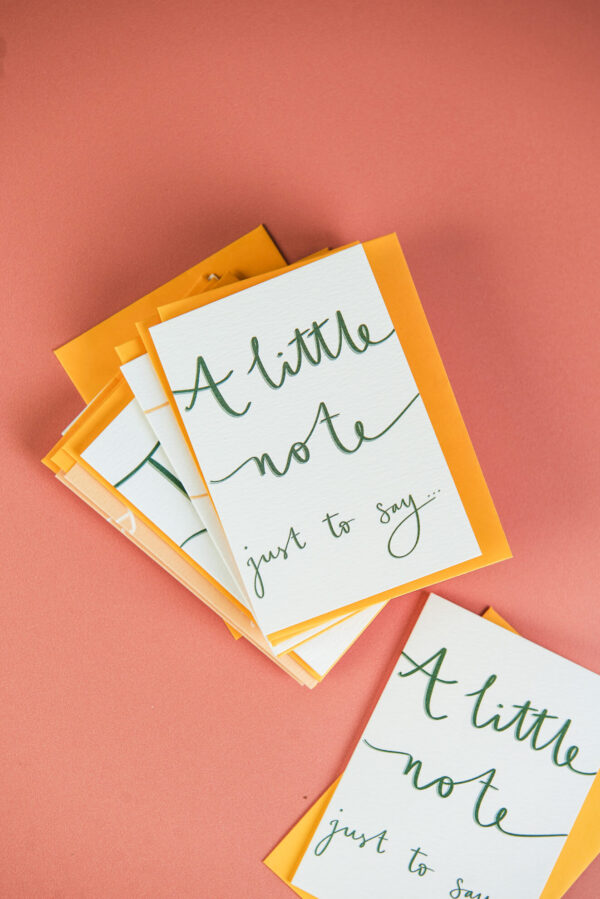 pile of mini notecards that read 'A little note just to say'