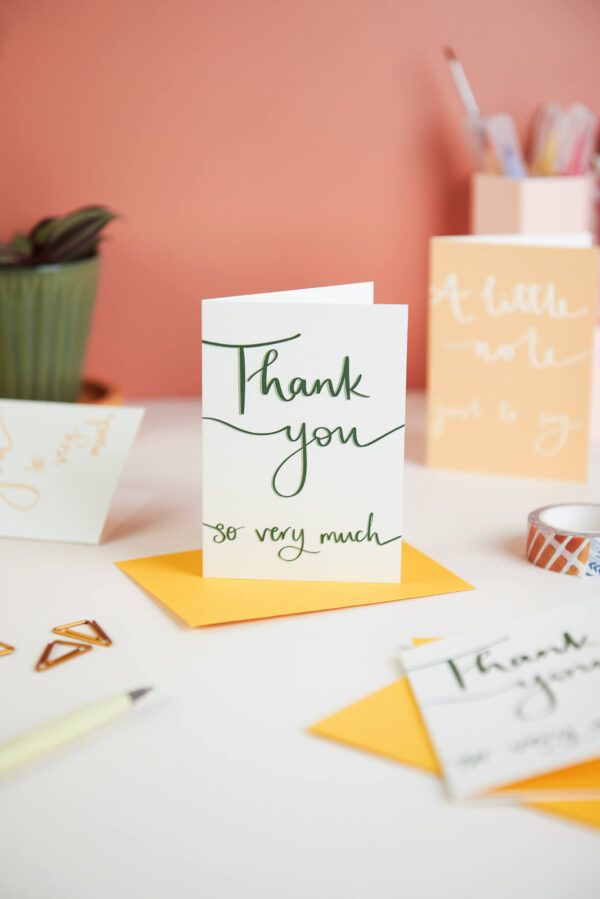 mini notecards set with thank you messages on a desk