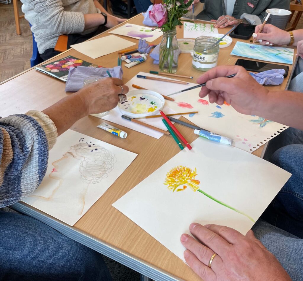 Watercolour workshop, hands painting watercolours