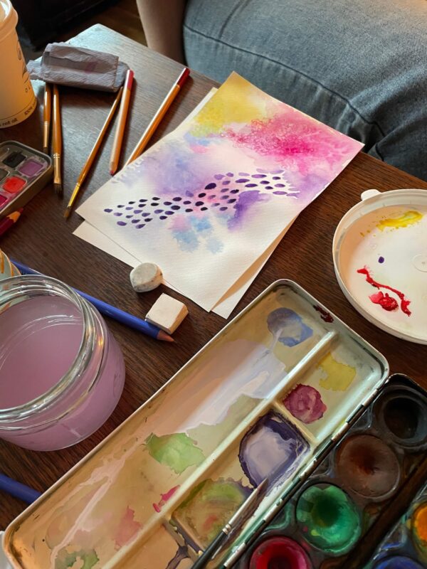Watercolour workshop, paints on a table and watercolour patterns