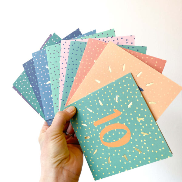 10 birthday card bundle - hand holding 10 spotty birthday cards