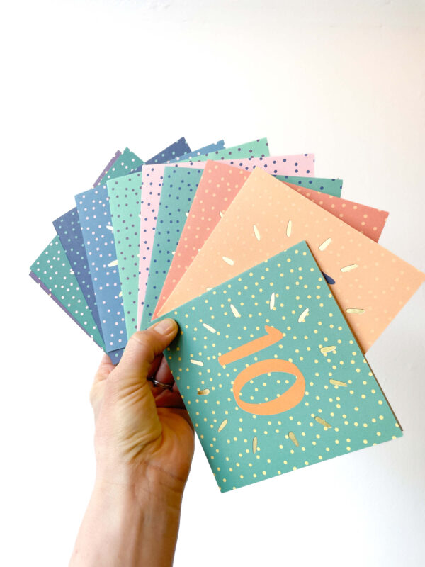10 birthday card bundle - hand holding 10 spotty birthday cards