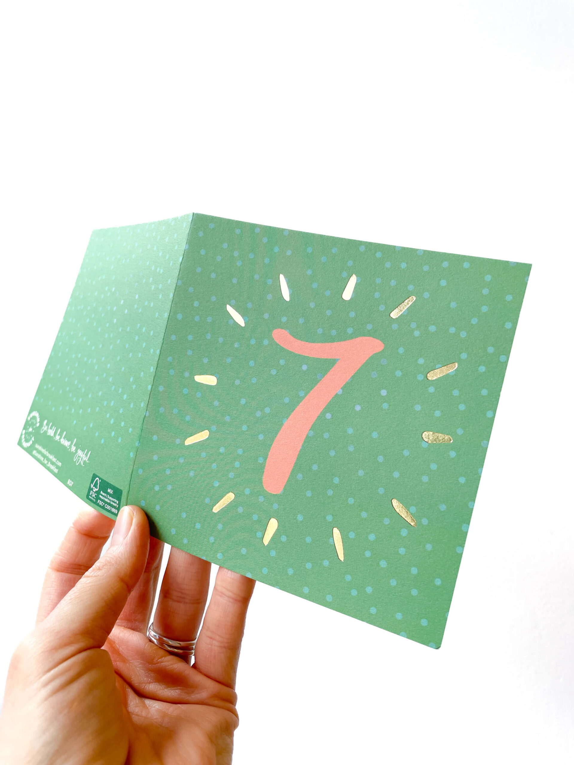 7th birthday card in green and orange spotty design